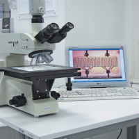 High magnification microscope with computer integration
